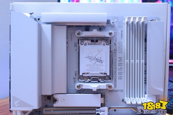 Gigabyte B650M AORUS STEALTH motherboard showcasing the CPU socket, DIMM slots, and branding on a white PCB background.