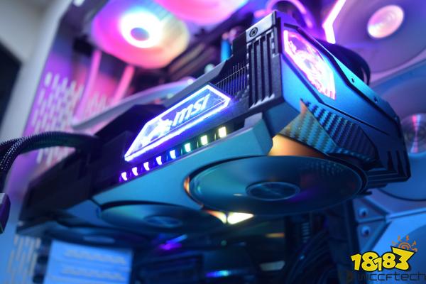 An MSI graphics card with RGB lighting is installed in a desktop computer setup.