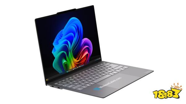 A Lenovo ThinkPad laptop is open displaying a vibrant, abstract Windows 11 wallpaper on its screen.