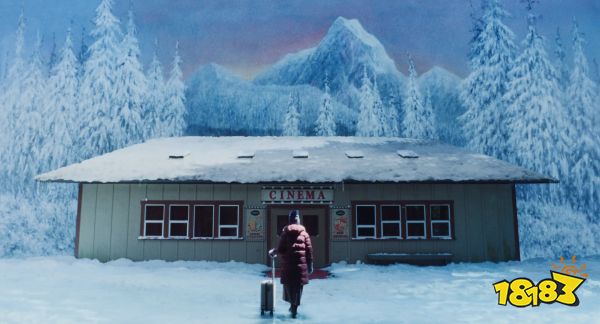 A woman in a snowy landscape walking inside a theater in Teenage Sex and Death at Camp Miasma still