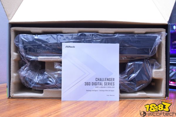 An ASRock Challenger 360 Digital Series AIO liquid cooler is partially unpacked from its box, accompanied by a user manual.