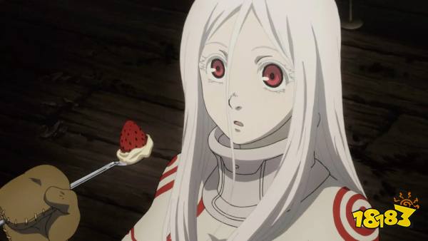 A white haired girl eats strawberry and cream in Deadman Wonderland