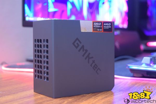 A GMKtec mini PC is shown on a desk with labels indicating it has an AMD Ryzen AI 9 HX processor and AMD Radeon Graphics.